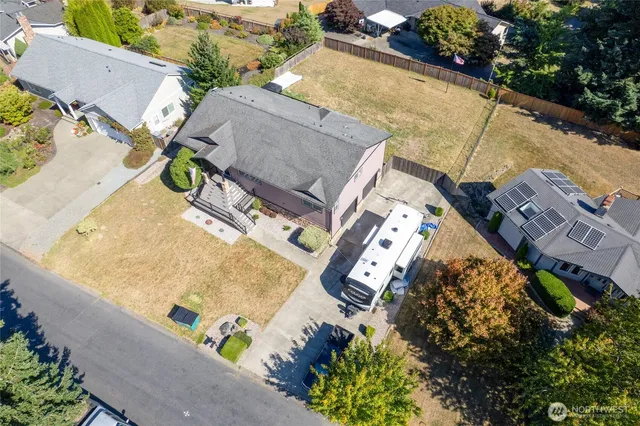 an aerial view of residential house with outdoor space and swimming pool