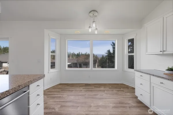 a workspace with furniture window and wooden floor