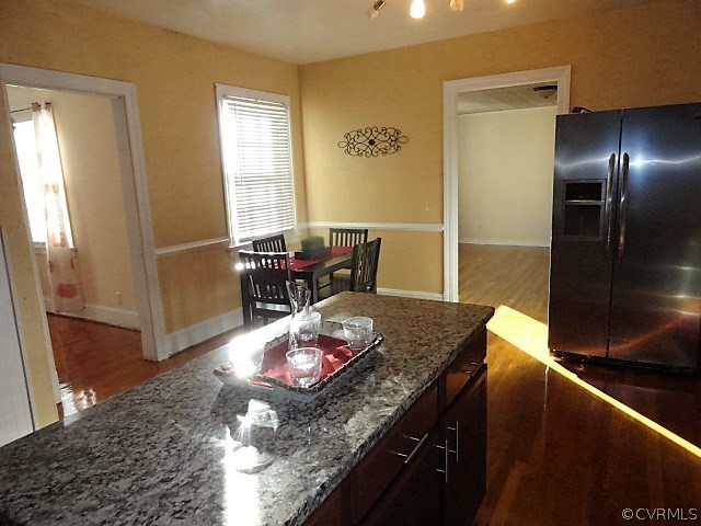 2100 Springdale Road Richmond, VA 23222 - Photo 12 of 28 a view of a dining room with furniture and a wooden floor