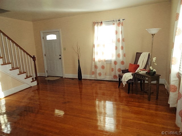 2100 Springdale Road Richmond, VA 23222 - Photo 14 of 28 a living room with furniture floor to ceiling window and wooden floor