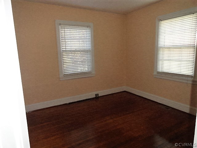 2100 Springdale Road Richmond, VA 23222 - Photo 26 of 28 a view of an empty room with wooden floor and a window