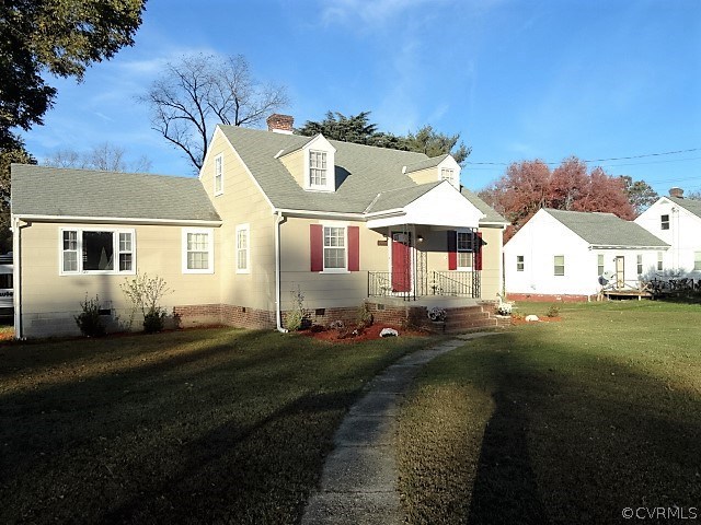 2100 Springdale Road Richmond, VA 23222 - Photo 3 of 28 a front view of a house with a garden