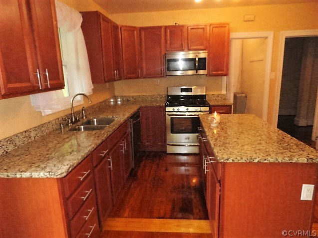 2100 Springdale Road Richmond, VA 23222 - Photo 8 of 28 a kitchen with stainless steel appliances granite countertop a sink stove and refrigerator