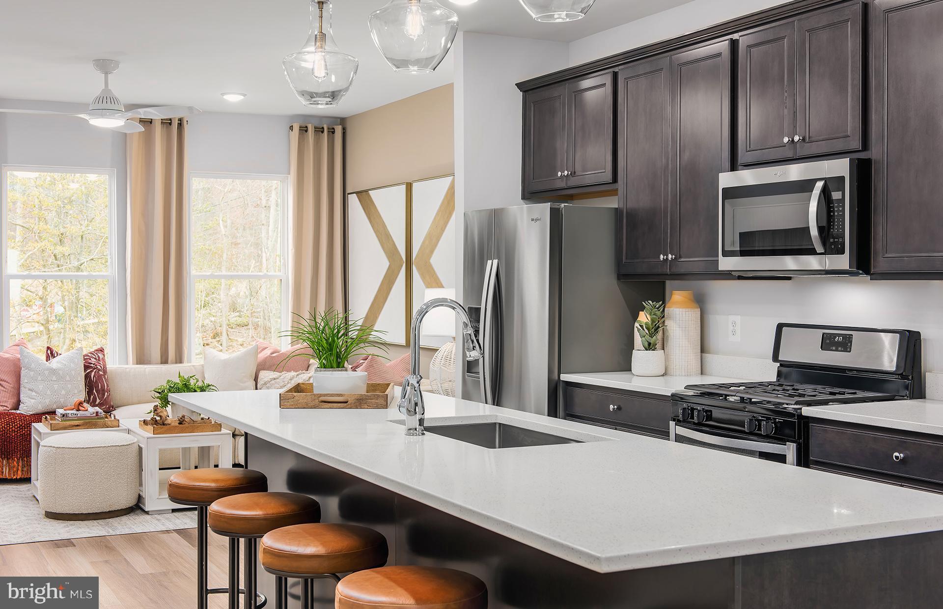 201 Intertidal Lane Laurel, MD 20724 - Photo 3 of 29 a kitchen with a stove a sink and a refrigerator