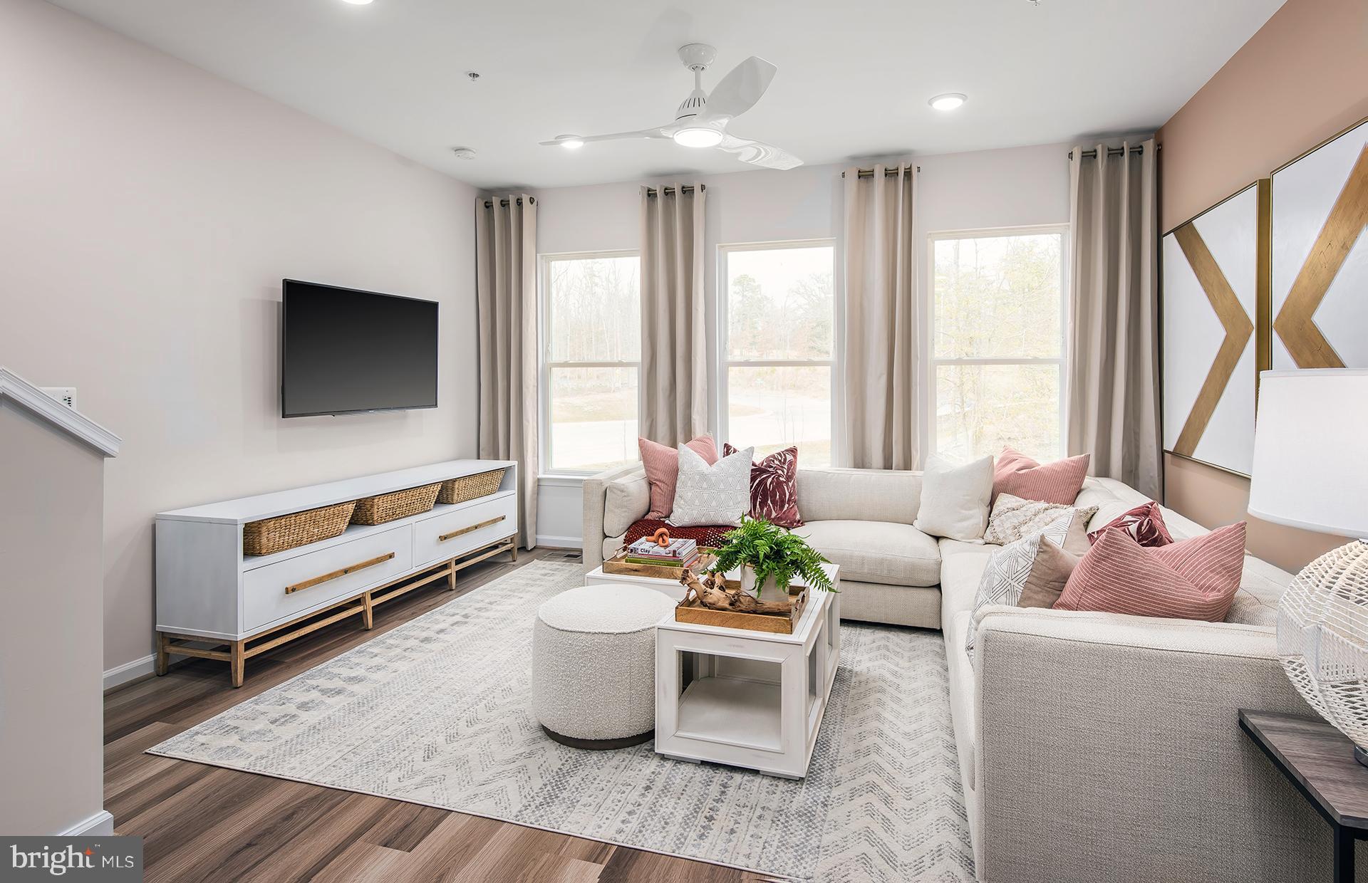201 Intertidal Lane Laurel, MD 20724 - Photo 7 of 29 a living room with furniture and a flat screen tv