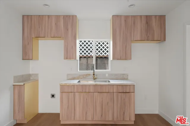 a bathroom with a sink a mirror and a shower