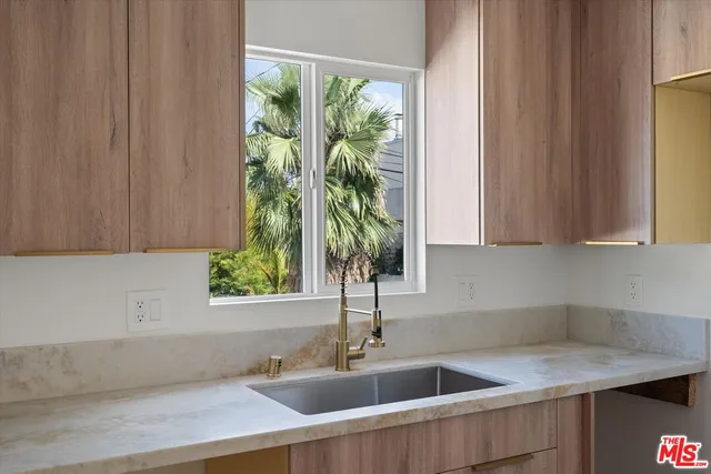 a kitchen with a sink and a window