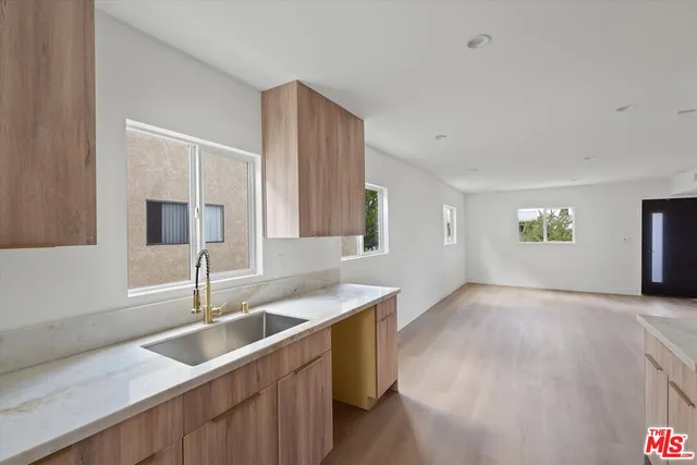 a kitchen with a sink and a window