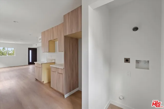 a view of a kitchen cabinets and wooden floor