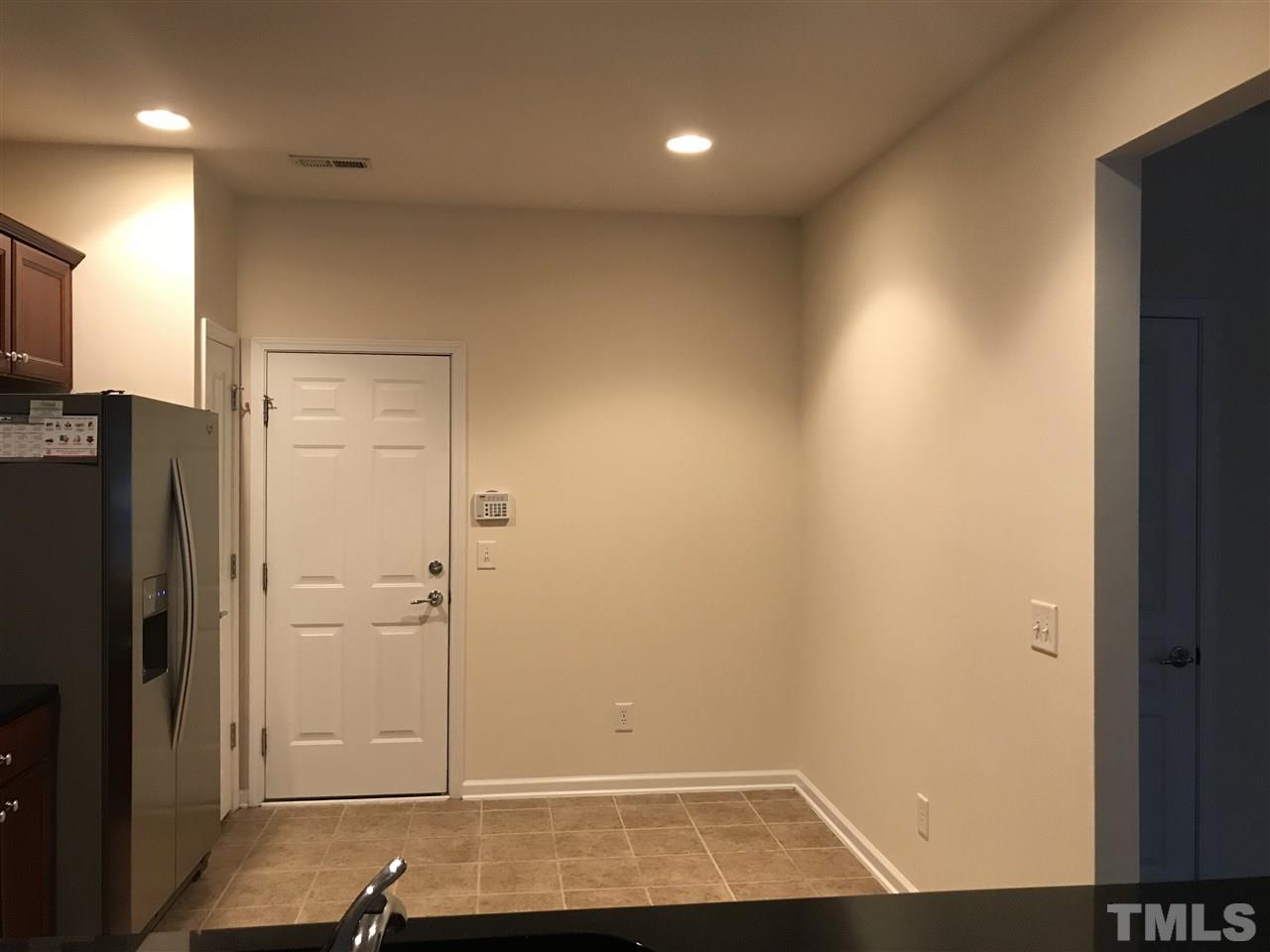 8213 Saltwood Place Raleigh, NC 27617 - Photo 3 of 13 a view of storage and utility room with refrigerator