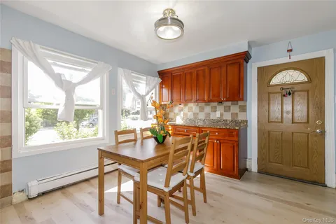 a dining room with furniture and window