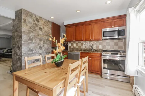 a kitchen with a stove a sink and a refrigerator