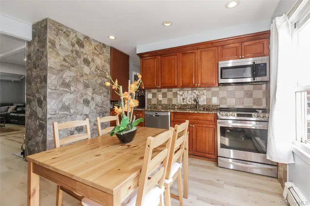 a kitchen with a stove a sink and a refrigerator