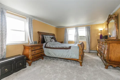 a bedroom with furniture and windows