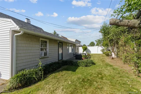 a view of a backyard with furniture
