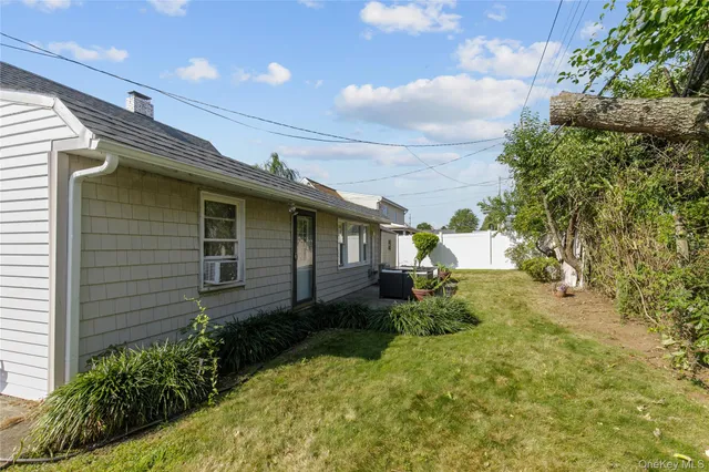 a view of a backyard with furniture