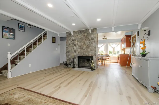 a view of a living room a fireplace and entryway