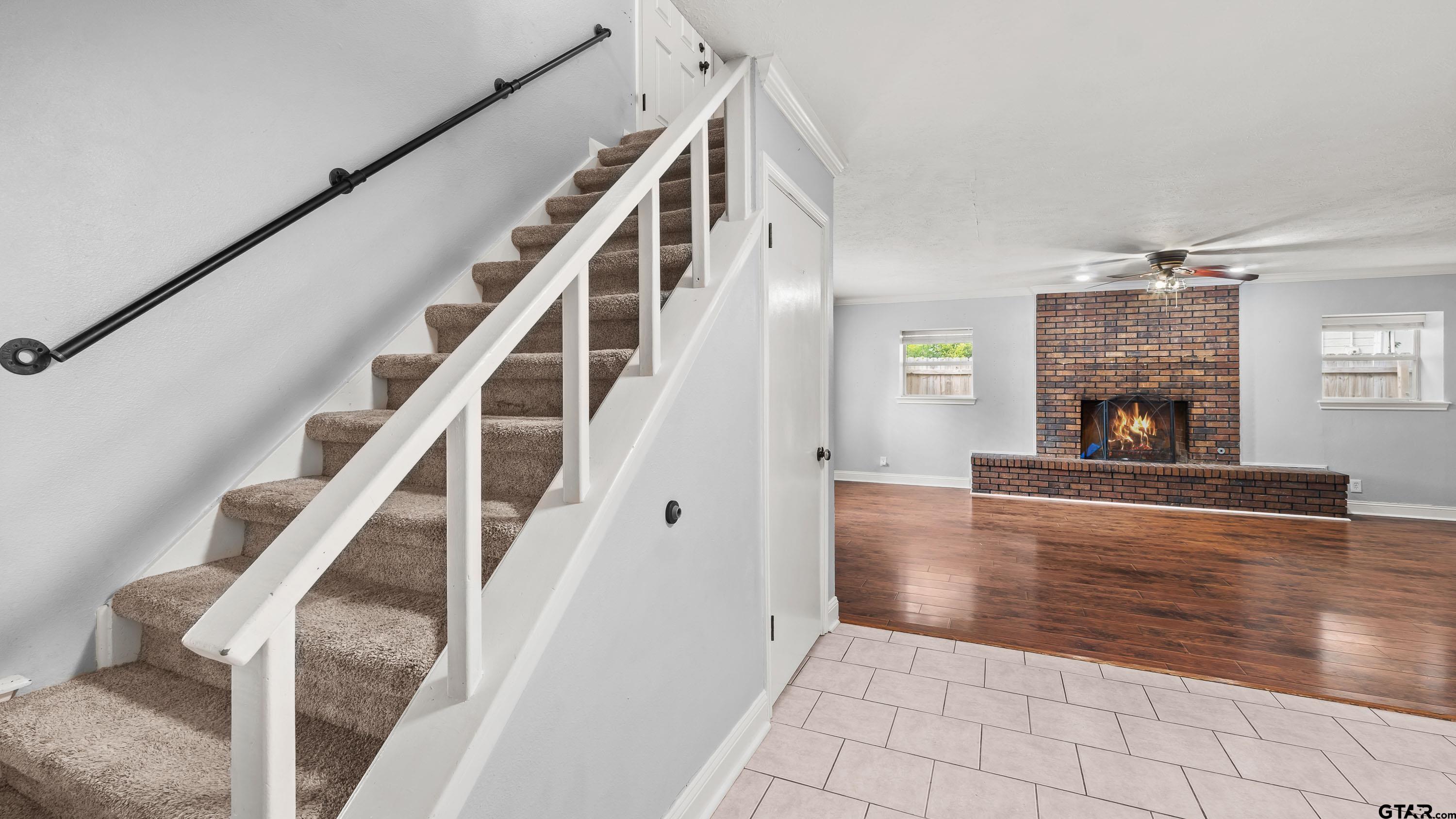 3418 Main Street Texarkana, TX 75503 - Photo 14 of 28 a view of an empty room with wooden floor and a fireplace