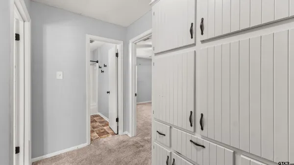 a view of a hallway with closet area