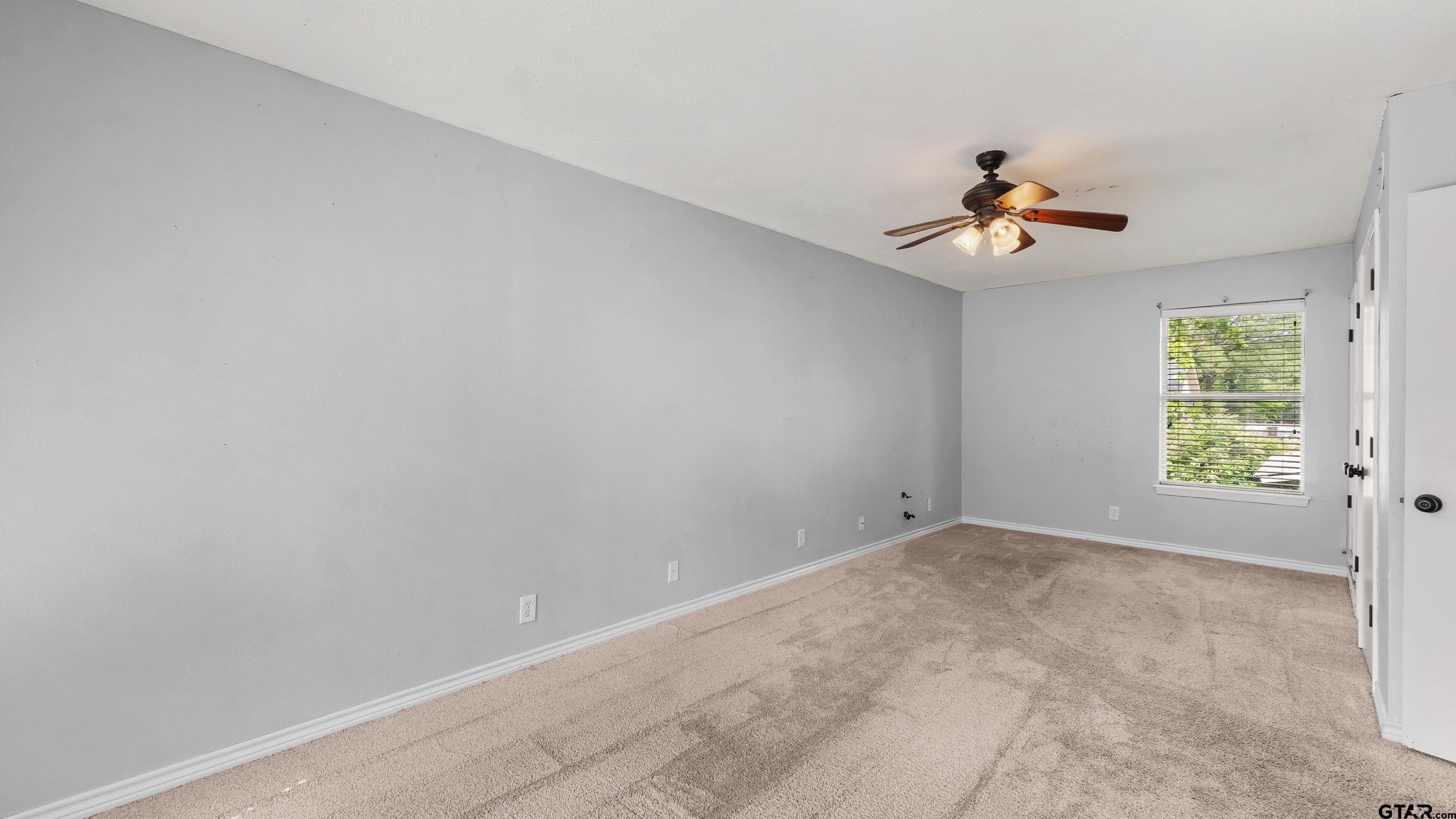 3418 Main Street Texarkana, TX 75503 - Photo 20 of 28 a view of room with a ceiling fan and window