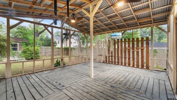 a view of porch with wooden floor
