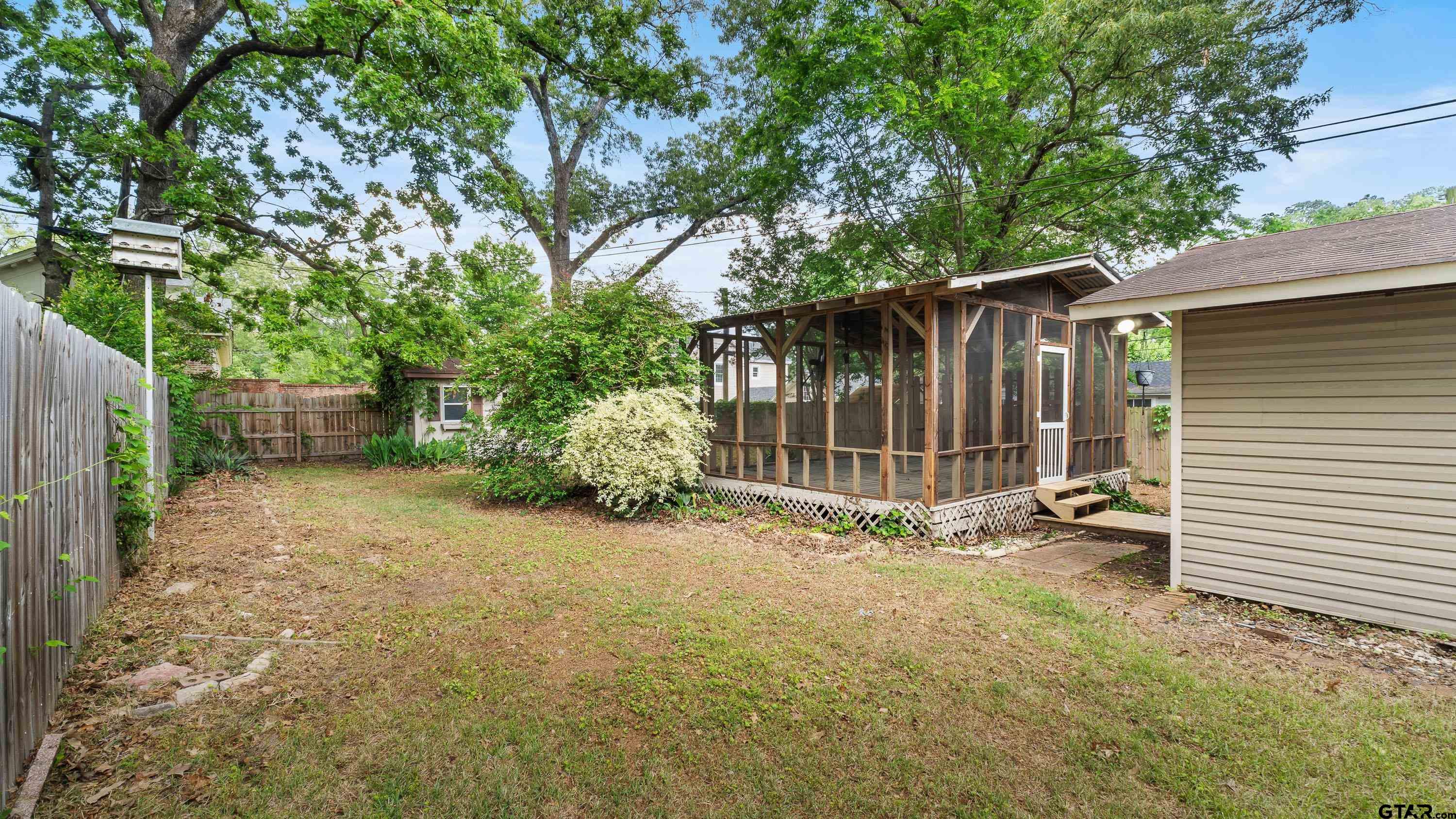 3418 Main Street Texarkana, TX 75503 - Photo 26 of 28 a view of backyard and trees