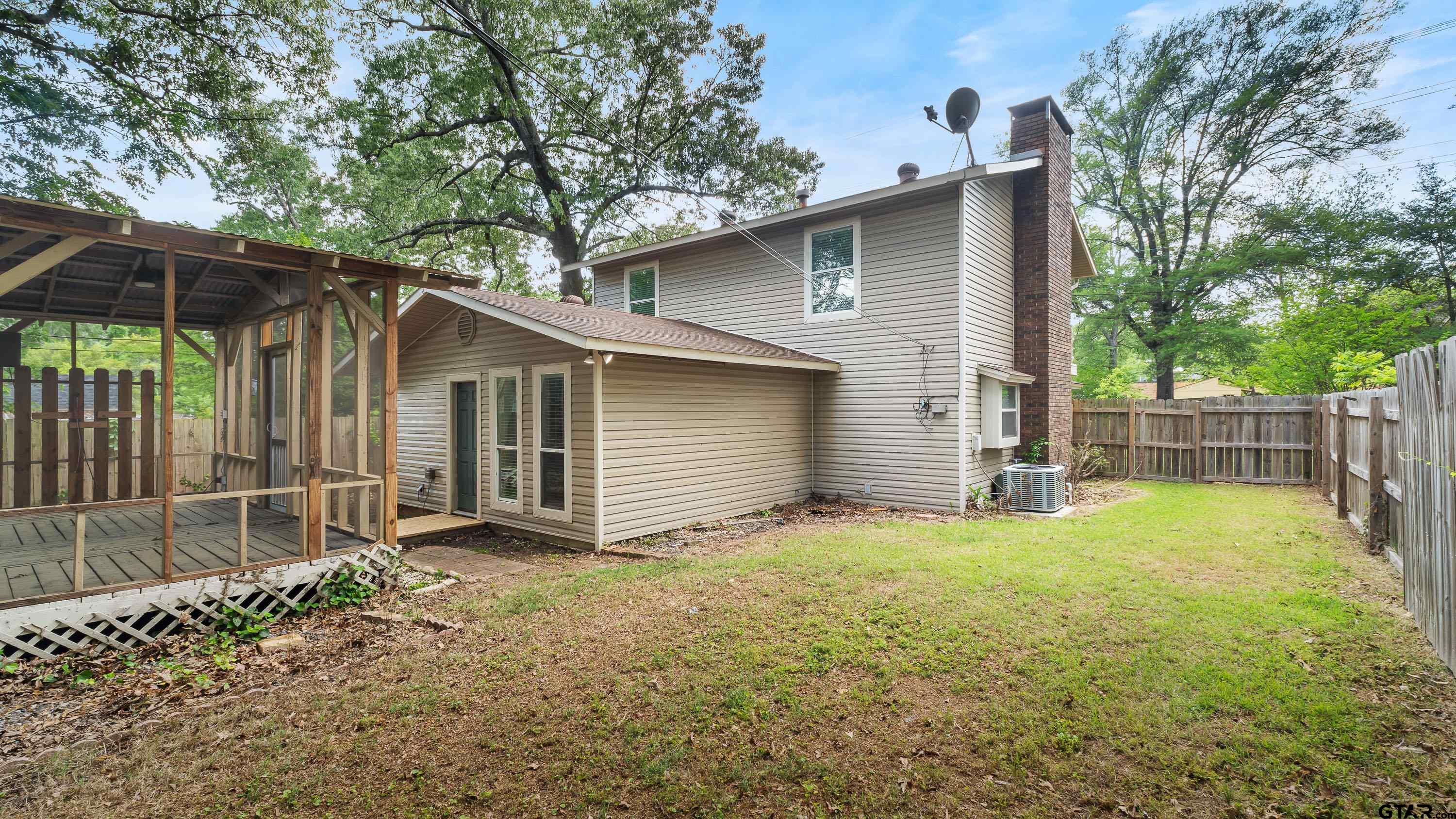 3418 Main Street Texarkana, TX 75503 - Photo 27 of 28 a backyard of a house with yard and tree
