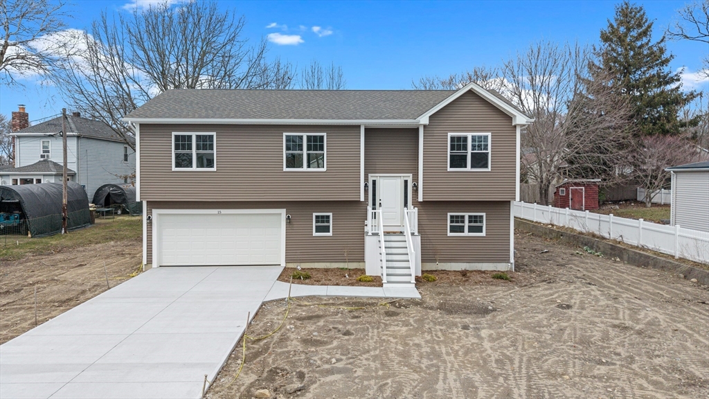 15 Jean Street Acushnet, MA 02743 - Photo 1 of 42 a front view of a house with a yard and garage