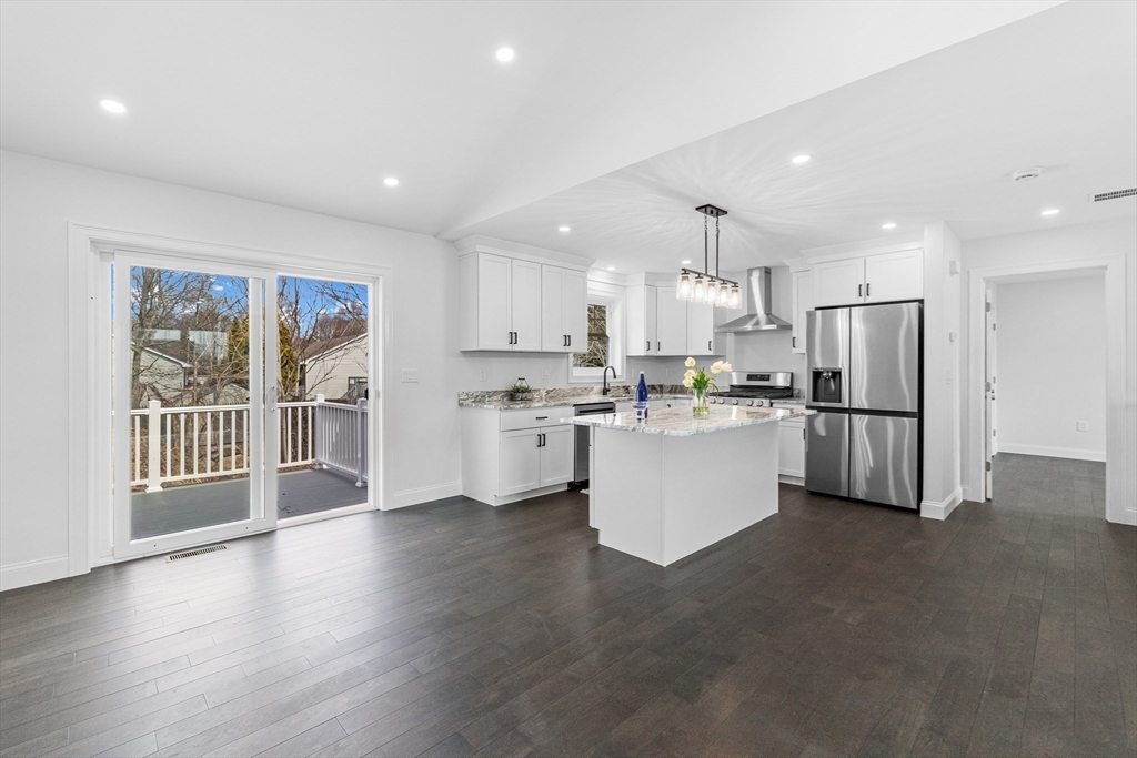 15 Jean Street Acushnet, MA 02743 - Photo 11 of 42 a kitchen with stainless steel appliances wooden cabinets and a refrigerator