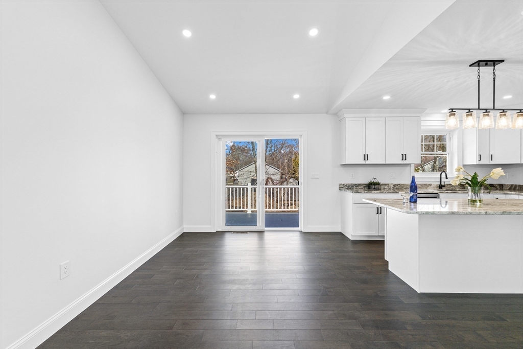 15 Jean Street Acushnet, MA 02743 - Photo 12 of 42 a open kitchen with white cabinets and wooden floor