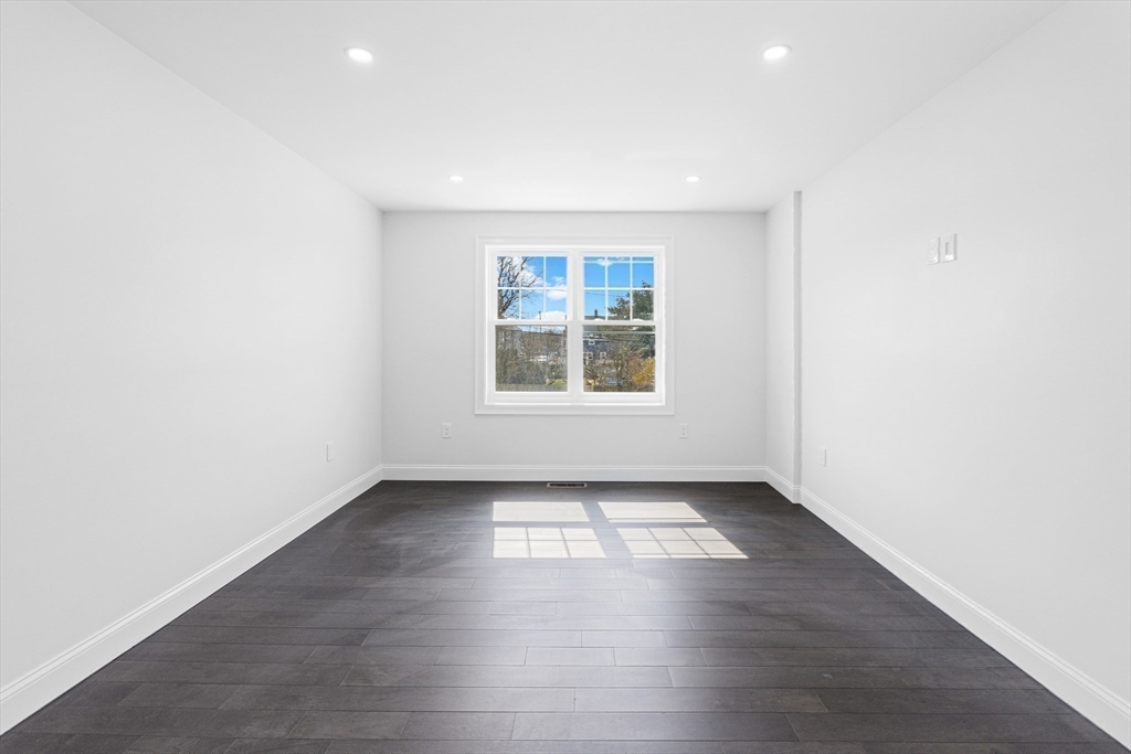 15 Jean Street Acushnet, MA 02743 - Photo 16 of 42 an empty room with wooden floor and windows
