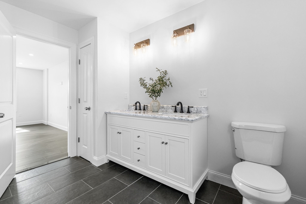 15 Jean Street Acushnet, MA 02743 - Photo 20 of 42 a bathroom with a toilet a sink and mirror
