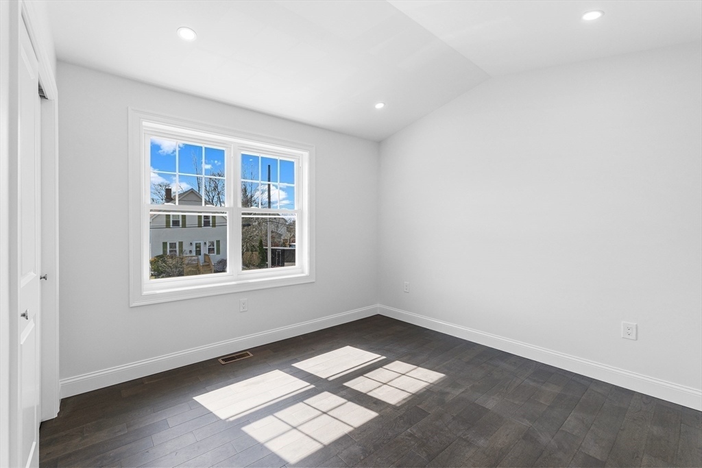 15 Jean Street Acushnet, MA 02743 - Photo 23 of 42 an empty room with wooden floor and windows