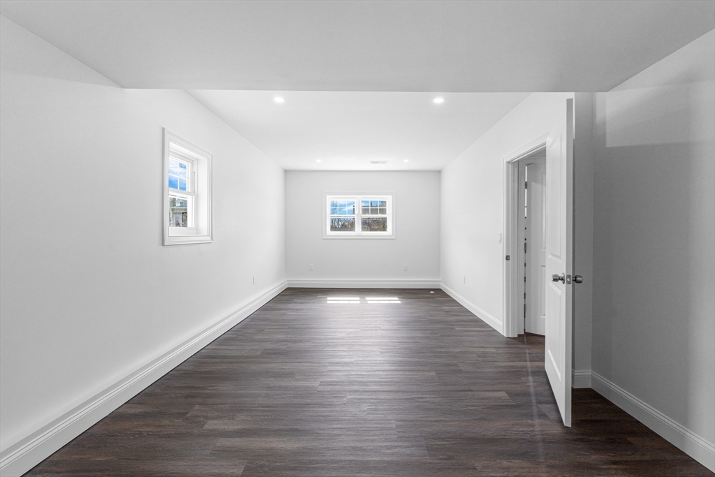 15 Jean Street Acushnet, MA 02743 - Photo 33 of 42 an empty room with wooden floor and windows