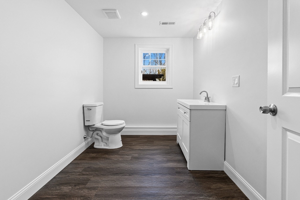 15 Jean Street Acushnet, MA 02743 - Photo 34 of 42 a bathroom with a toilet and a mirror