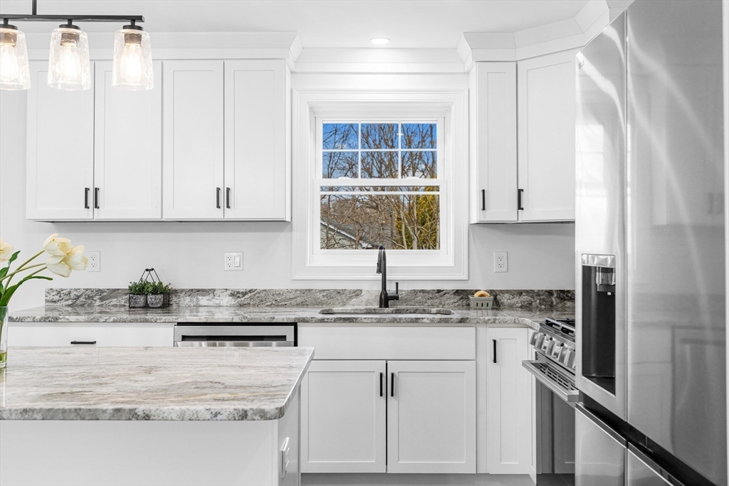 15 Jean Street Acushnet, MA 02743 - Photo 5 of 42 a kitchen with stainless steel appliances granite countertop a sink stove and cabinets