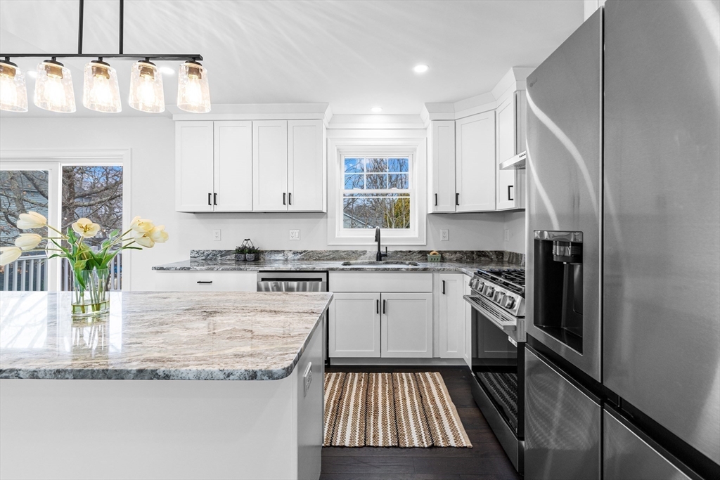15 Jean Street Acushnet, MA 02743 - Photo 6 of 42 a kitchen with stainless steel appliances granite countertop a stove a sink and a refrigerator