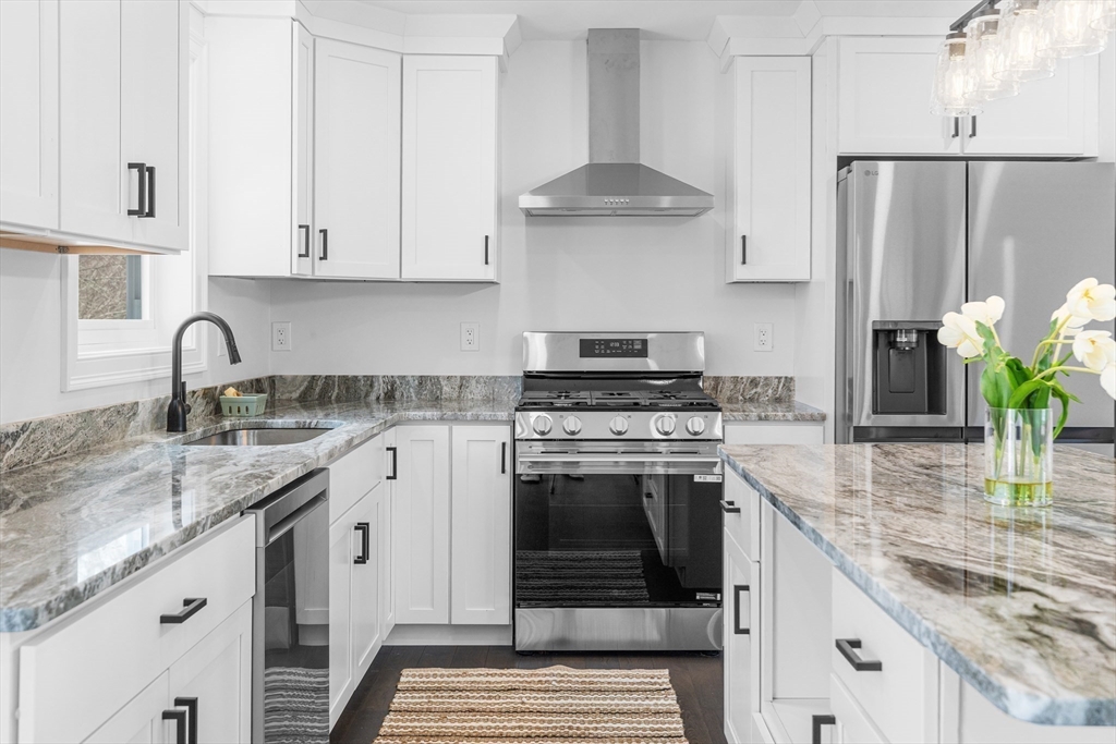 15 Jean Street Acushnet, MA 02743 - Photo 7 of 42 a kitchen with stainless steel appliances granite countertop a sink stove and refrigerator