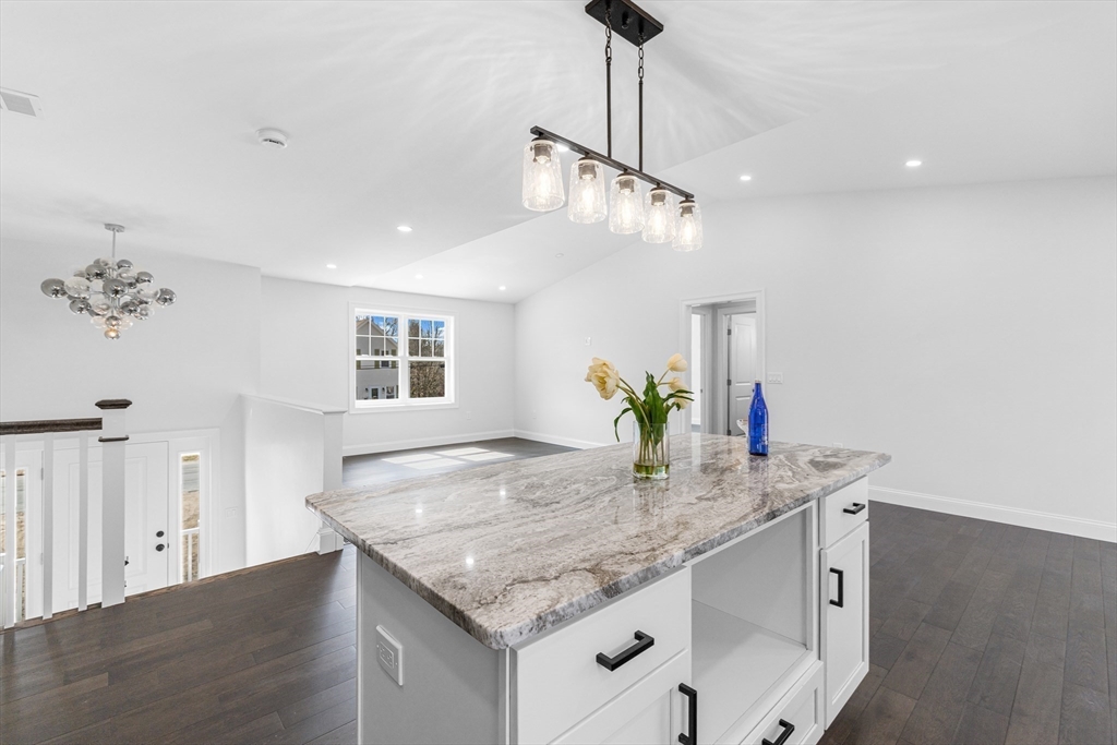 15 Jean Street Acushnet, MA 02743 - Photo 10 of 42 a kitchen with granite countertop kitchen island stainless steel appliances a sink and living room view