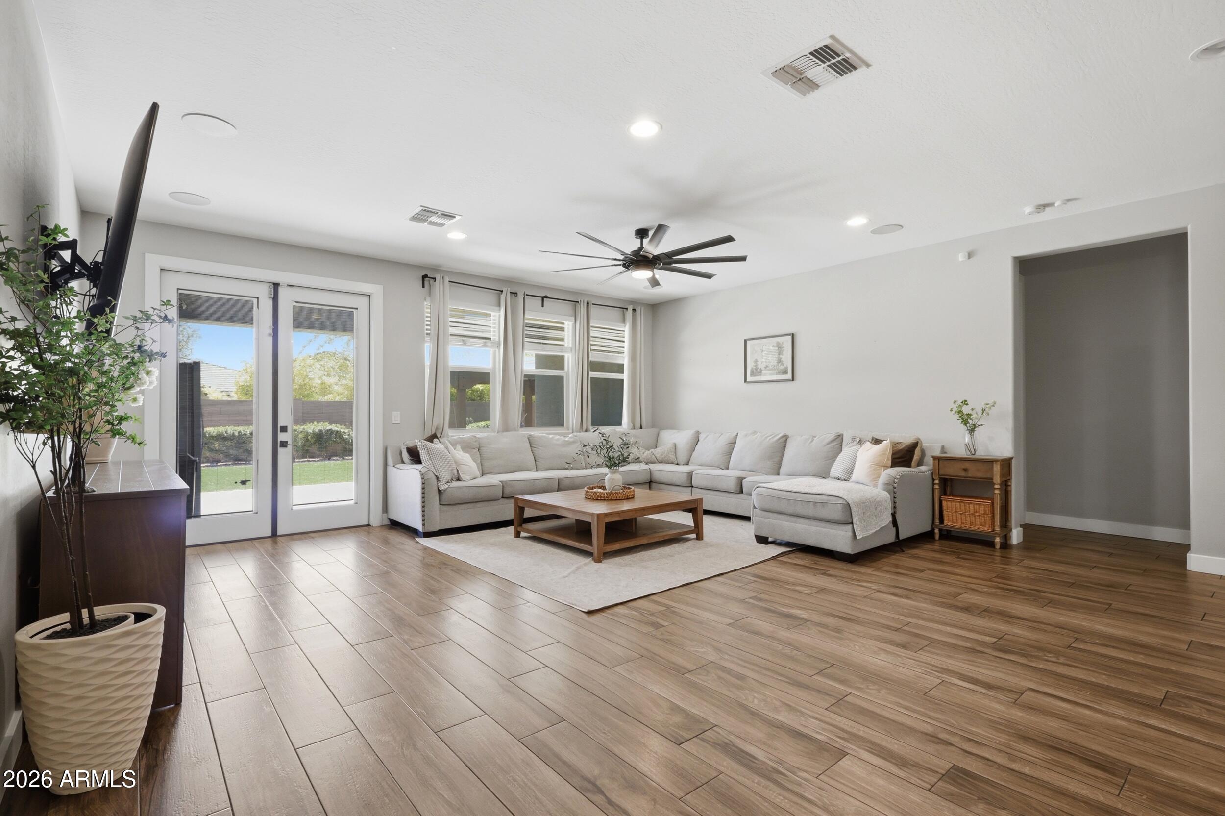 12517 West Lawrence Road Glendale, AZ 85307 - Photo 23 of 52 a living room with furniture and a large window