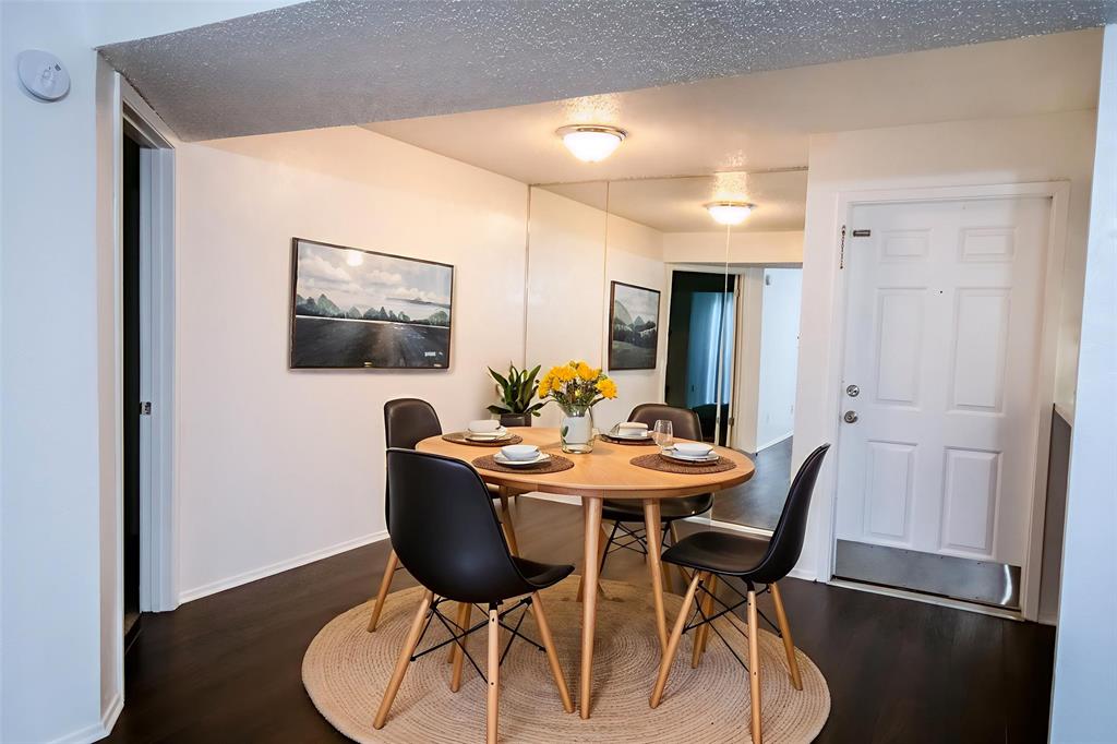 11460 Audelia Road, Unit 272 Dallas, TX 75243 - Photo 2 of 27 a view of a dining room with furniture and wooden floor