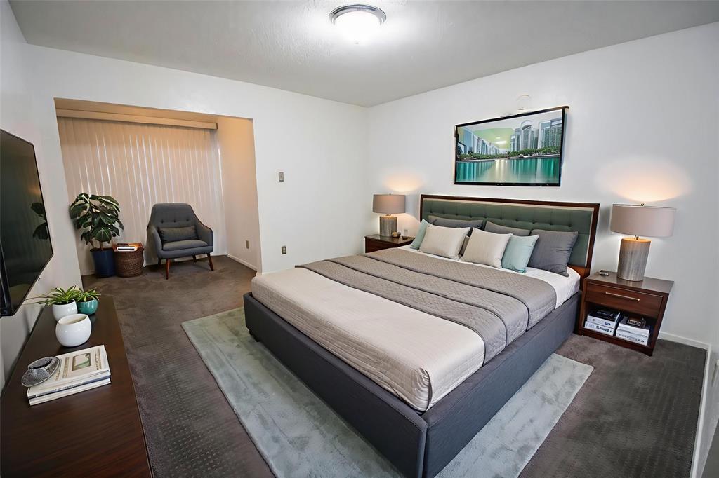 11460 Audelia Road, Unit 272 Dallas, TX 75243 - Photo 4 of 27 a bedroom with a bed a couch and dresser