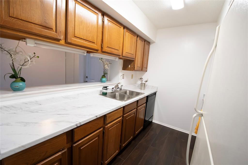 11460 Audelia Road, Unit 272 Dallas, TX 75243 - Photo 7 of 27 a kitchen with a sink cabinets and a window