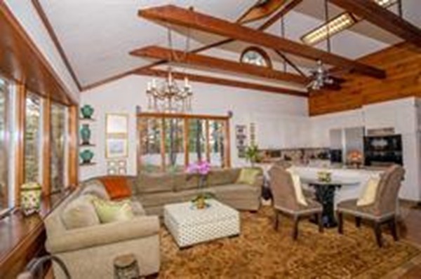 48 Mohawk Road Canton, MA 02021 - Photo 5 of 22 a living room with furniture a chandelier and a large window