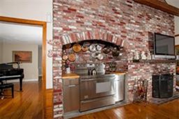 48 Mohawk Road Canton, MA 02021 - Photo 8 of 22 a kitchen with a stove and a fireplace