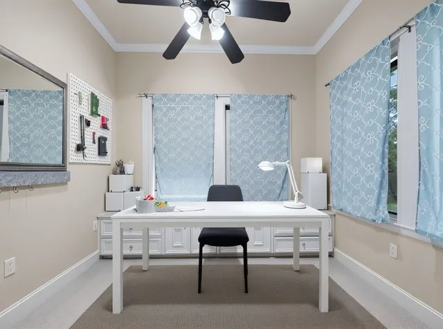 a workspace with furniture and window