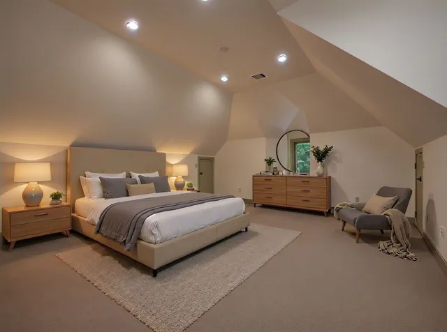 a spacious bedroom with a bed and window