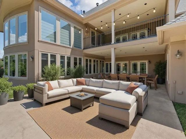 a view of a patio with couches and potted plants
