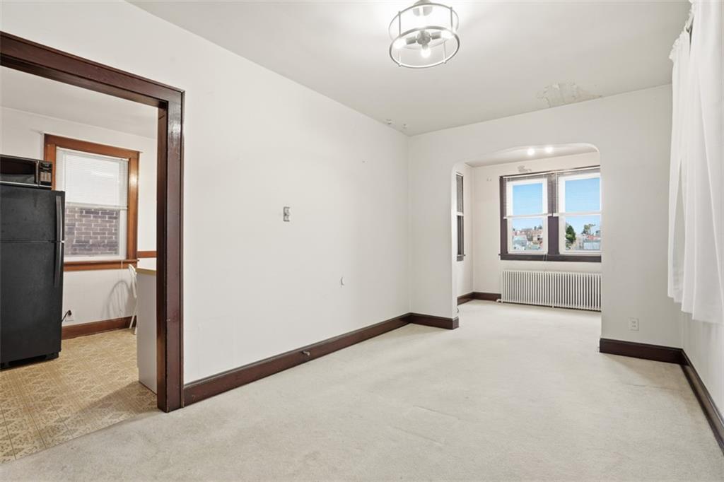 205 Clover Street Pittsburgh, PA 15210 - Photo 11 of 49 an empty room with windows and closet