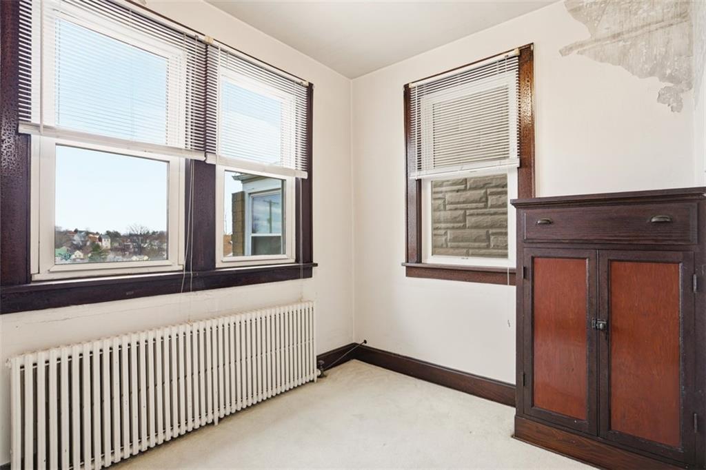 205 Clover Street Pittsburgh, PA 15210 - Photo 13 of 49 a view of an empty room with a window